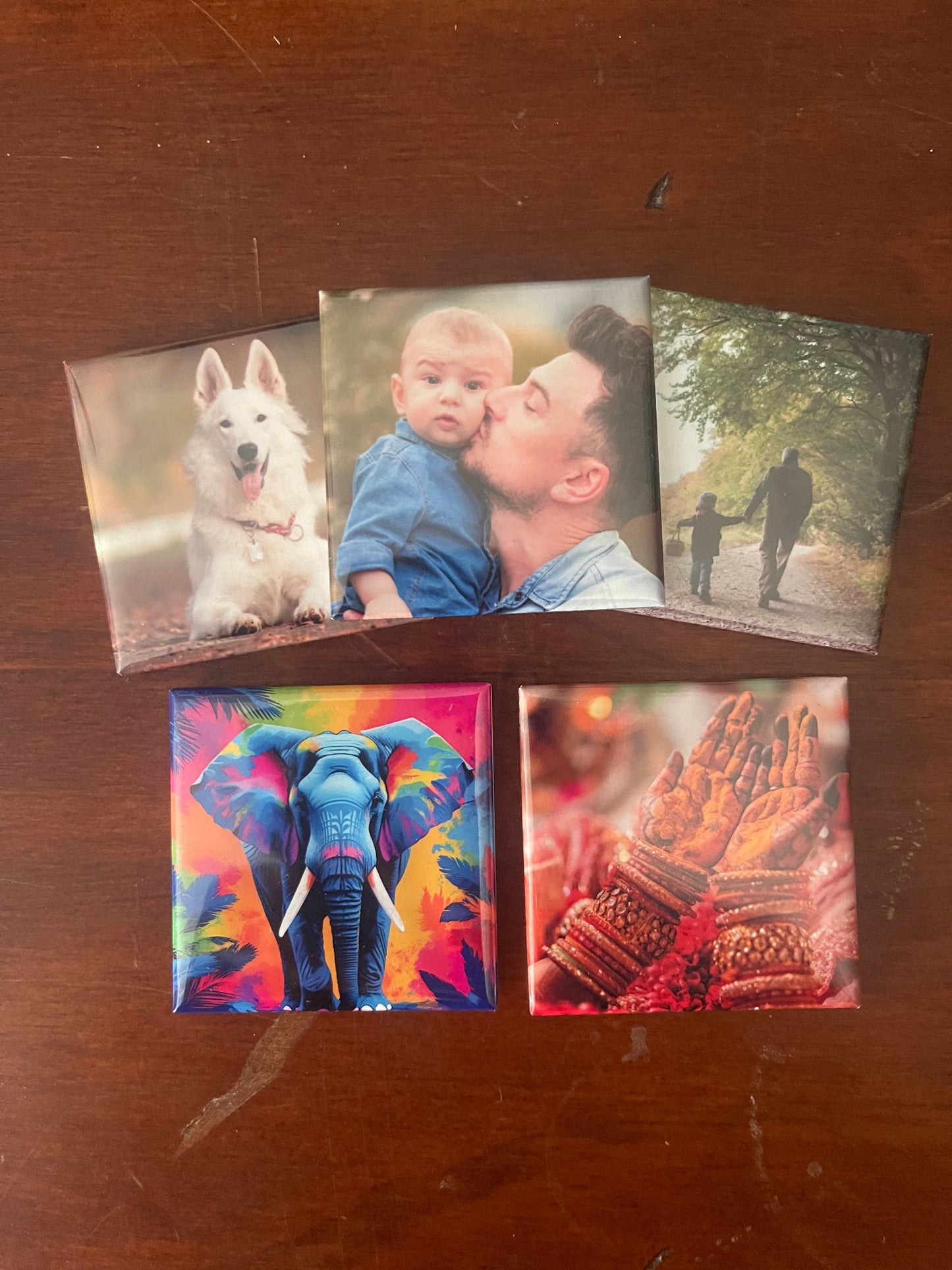 Collection of six photo prints on a wooden surface