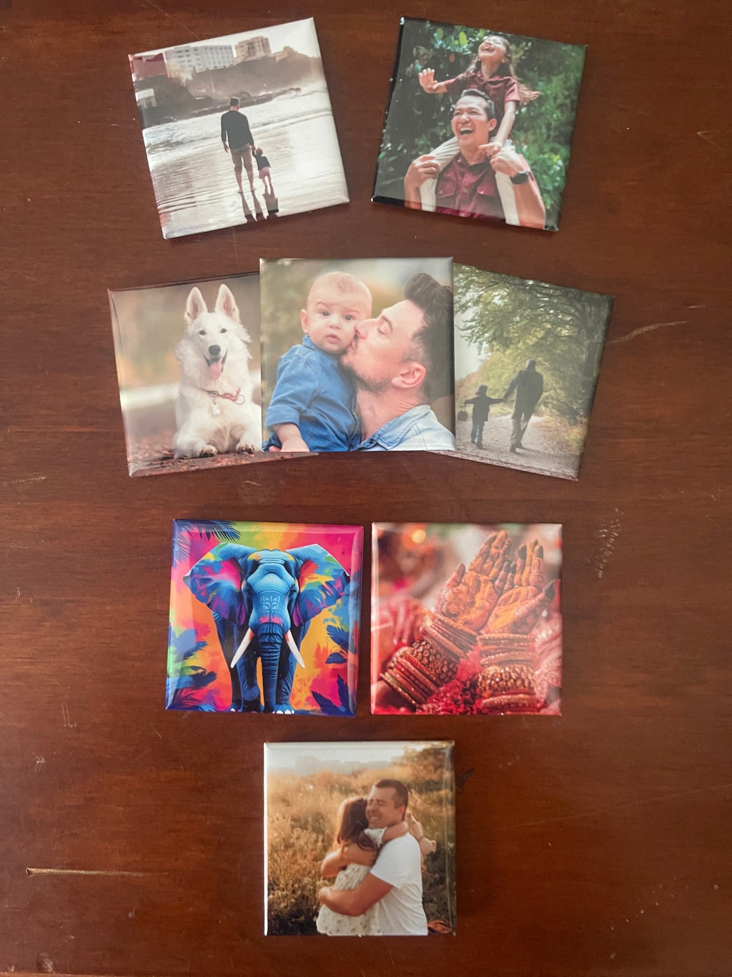 Collection of square photo prints on a wooden surface